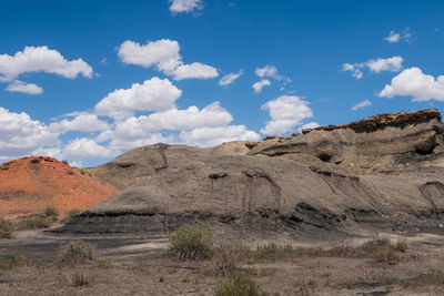 Bisti badlands in new mexico landscape of black and orange barren hillsides