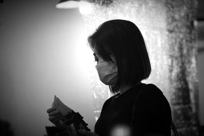 Portrait of woman looking at camera