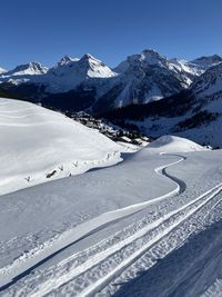 Scenic view of snowcapped mountains against sky