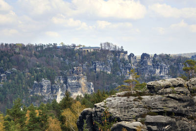 Panoramic view of rock formations against sky