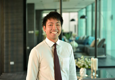 Portrait of businessman standing in office