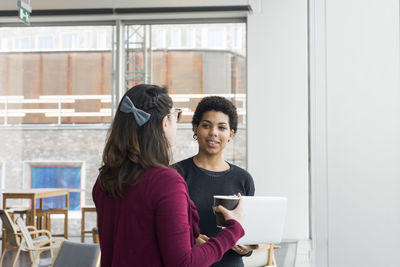 Woman talking in library