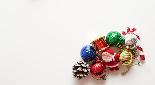 Close-up of christmas decorations on white background