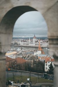 Cityscape seen through arch