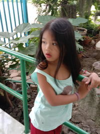 Portrait of girl standing outdoors