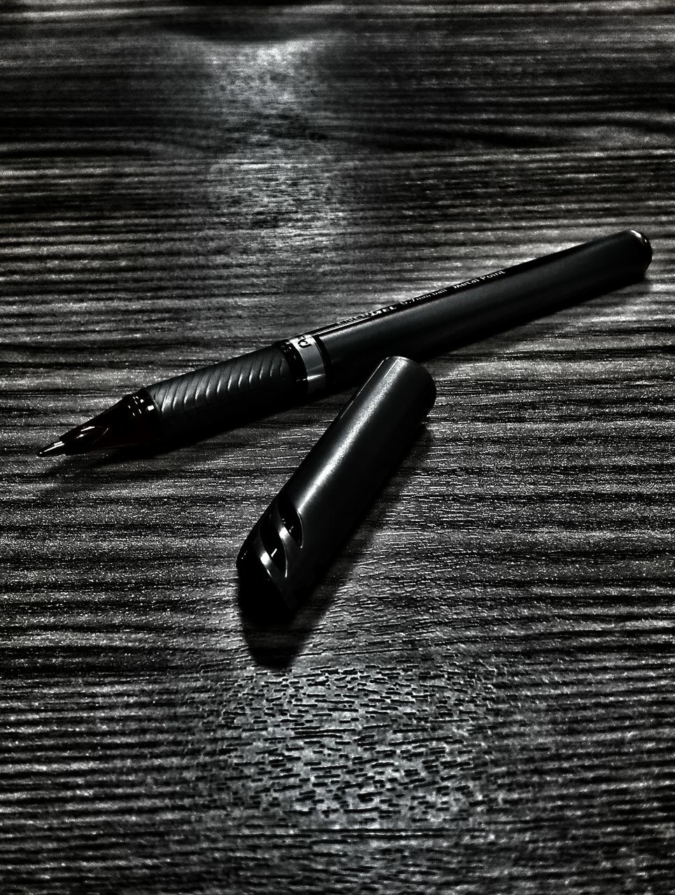 still life, indoors, close-up, table, high angle view, wood - material, single object, metal, no people, two objects, wooden, pen, wood, selective focus, music, equipment, pencil, simplicity, metallic, part of