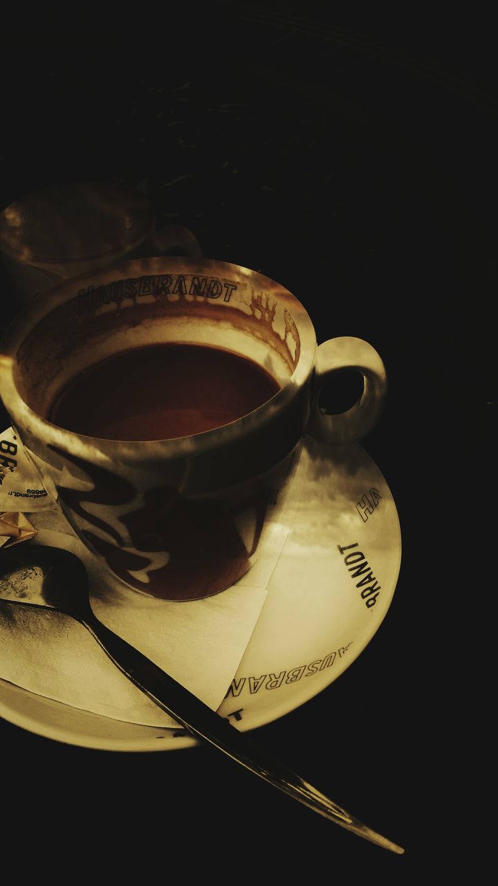 food and drink, drink, indoors, table, still life, coffee cup, refreshment, freshness, close-up, high angle view, text, coffee - drink, western script, cup, no people, communication, coffee, saucer, studio shot, frothy drink