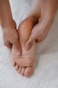 Foot spa massage treatment by professional massage therapist in spa resort. wellness, stress relief