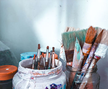 Close-up of paintbrushes on table