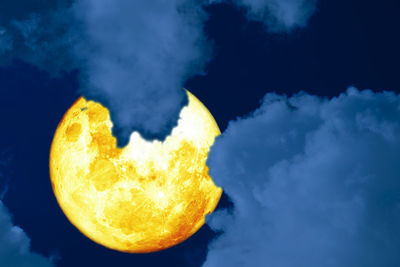 Close-up of orange against blue sky