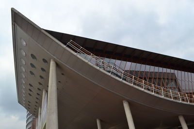 Low angle view of bridge and building against sky