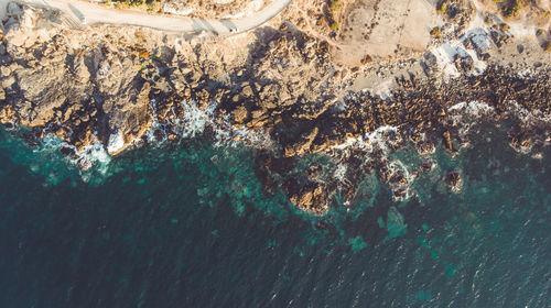 High angle view of rocks in sea