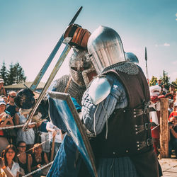 High angle view of people at traditional windmill against sky