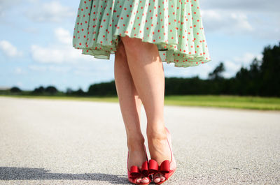 Low section of woman standing outdoors