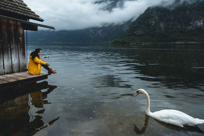 Side view of man on lake