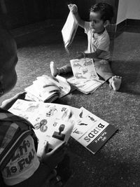 High angle view of people sitting on table