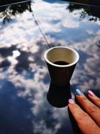 Close-up of hand holding tea cup