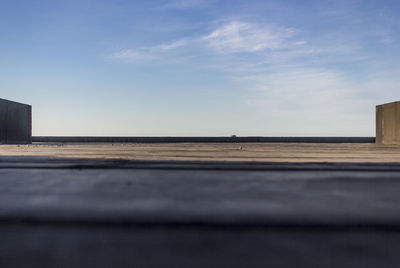 Road by city against clear sky