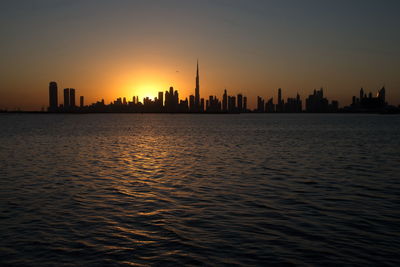 Dubai slyline from dubai creek harbour and dubai canal to downtown and business bay, uae