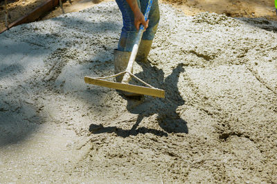 Low section of man working at construction site