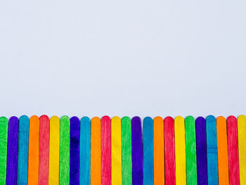 Close-up of multi colored pencils against white background