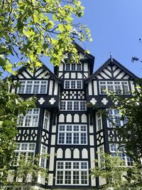 Low angle view of building against clear blue sky