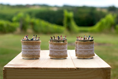 Colored pencils in desk organizers on table