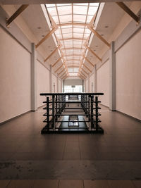 Empty chairs and tables in illuminated building