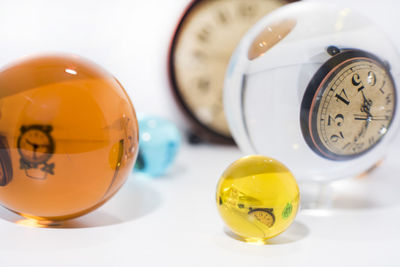 Close-up of yellow clock on table