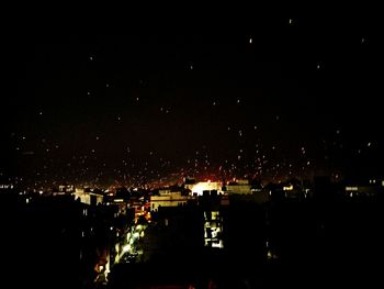 Illuminated cityscape at night