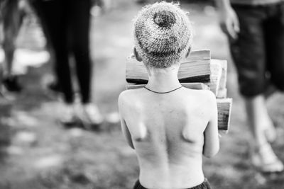 Rear view of shirtless boy