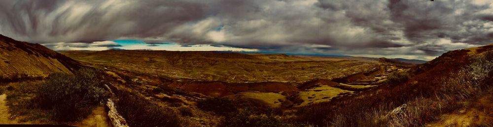 Panoramic view of landscape against cloudy sky