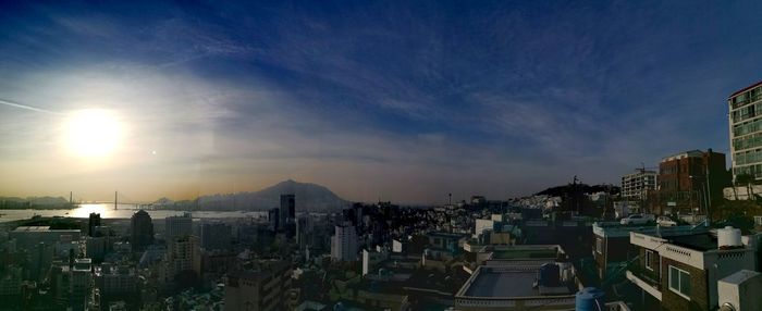 Panoramic view of city against sky during sunset