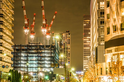 Illuminated buildings in city at night