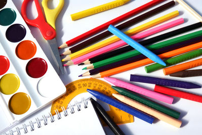 High angle view of multi colored pencils on table