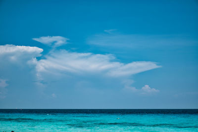 Scenic view of sea against blue sky