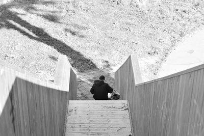 Rear view of man on wall