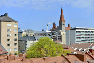 Buildings in city against sky