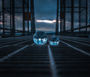 Close-up of crystal ball on glass