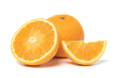 Close-up of orange slice against white background