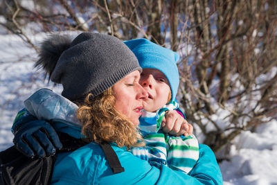 Portrait of a smiling woman in snow