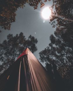 Low angle view of tent against sky on sunny day