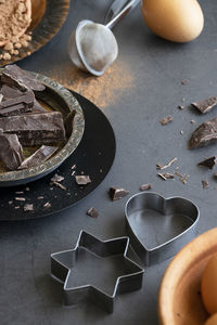 Mix of baking dessert ingredients on dark background, culinary flat lay