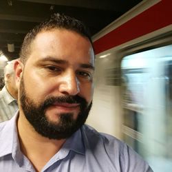 Portrait of man in train