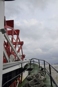 Built structure by sea against sky