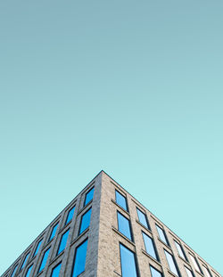 Low angle view of building against clear blue sky