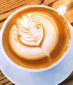 Close-up of cappuccino on table