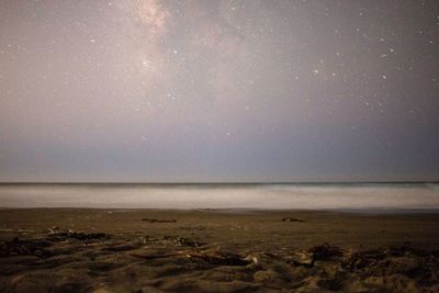 Scenic view of sea against sky at night