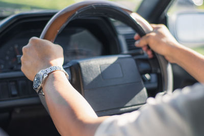 Close-up of hand holding car