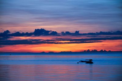 Scenic view of sunset over calm sea
